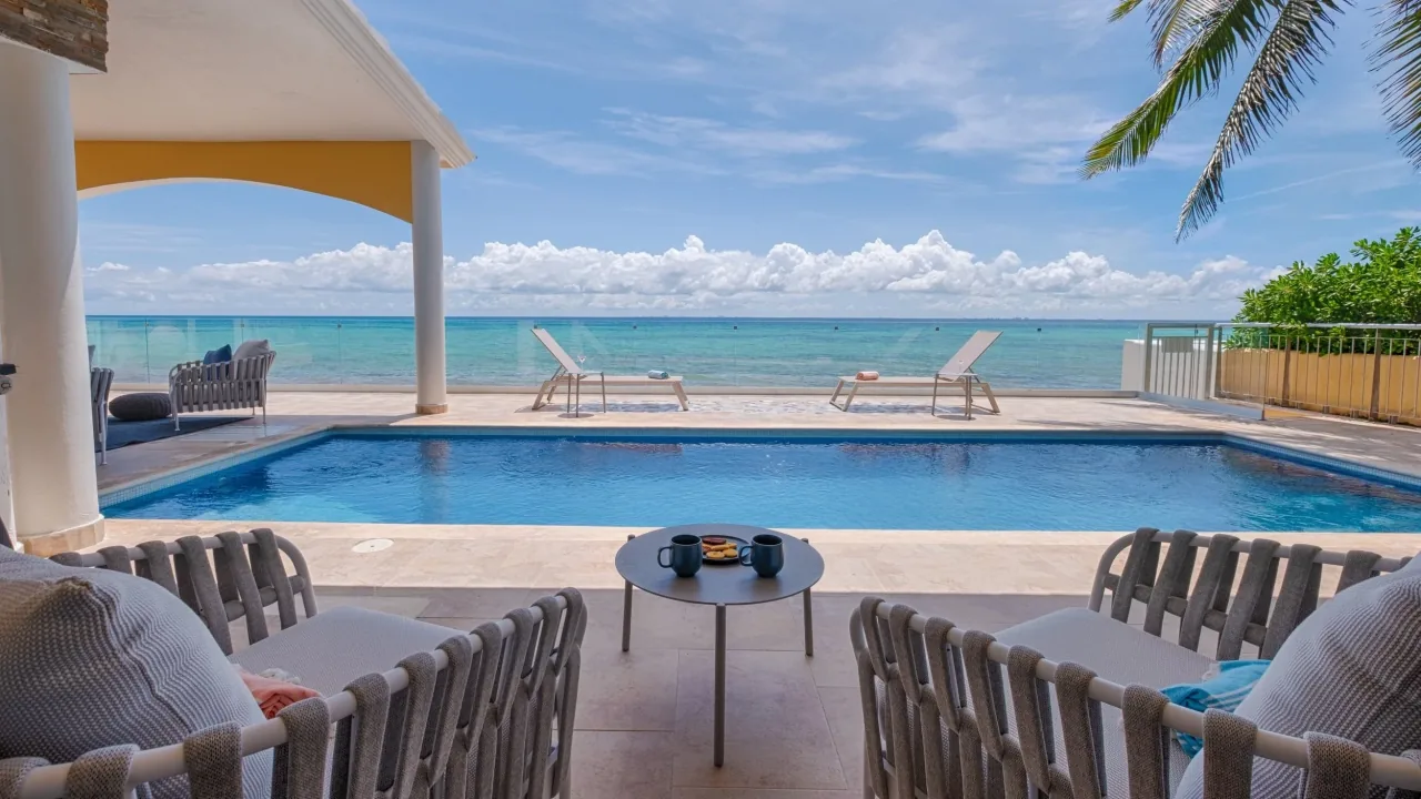 Casa Karma's shaded terrace and private pool overlooking the Caribbean in Playacar